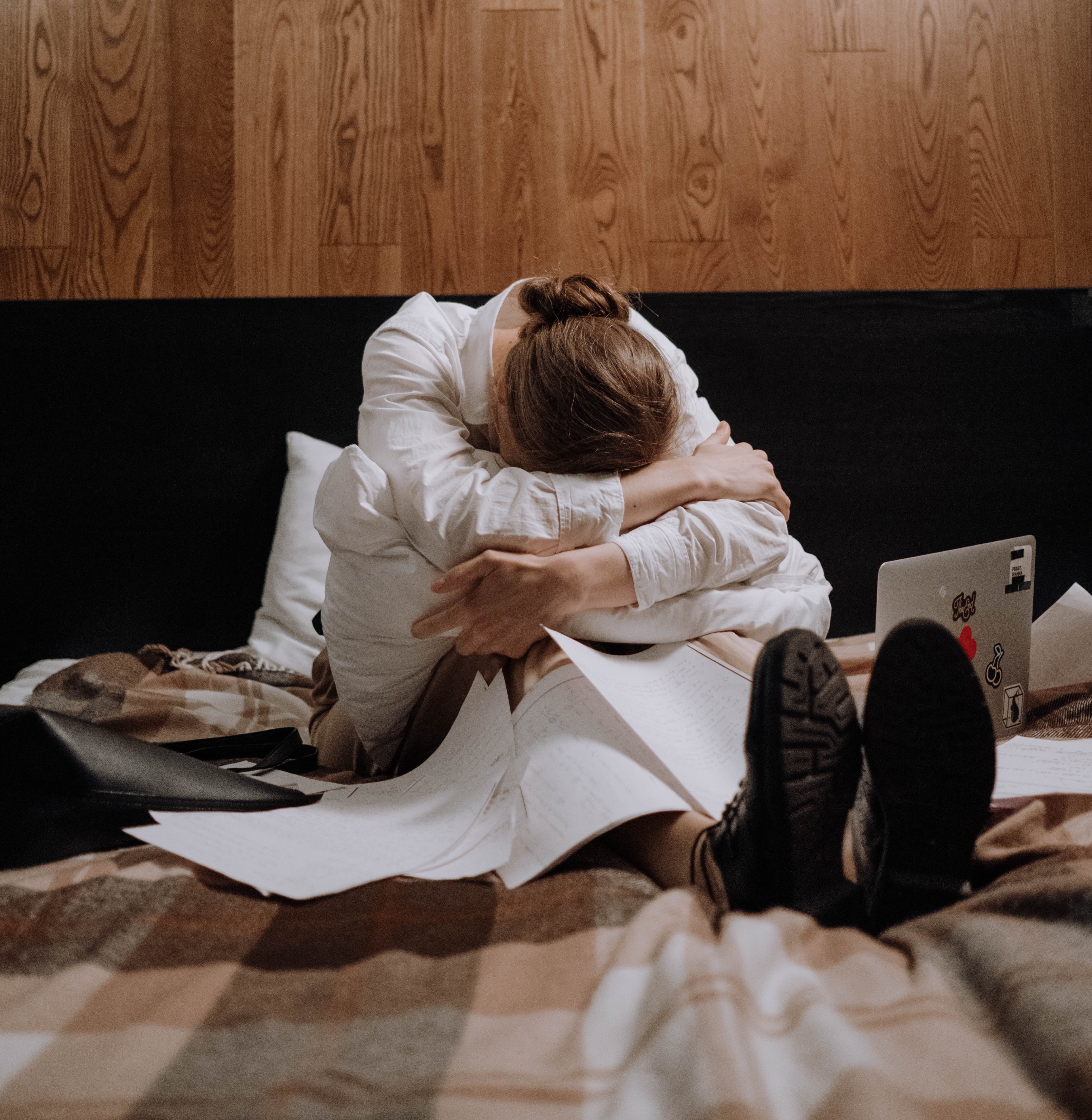 Woman on bed agonising